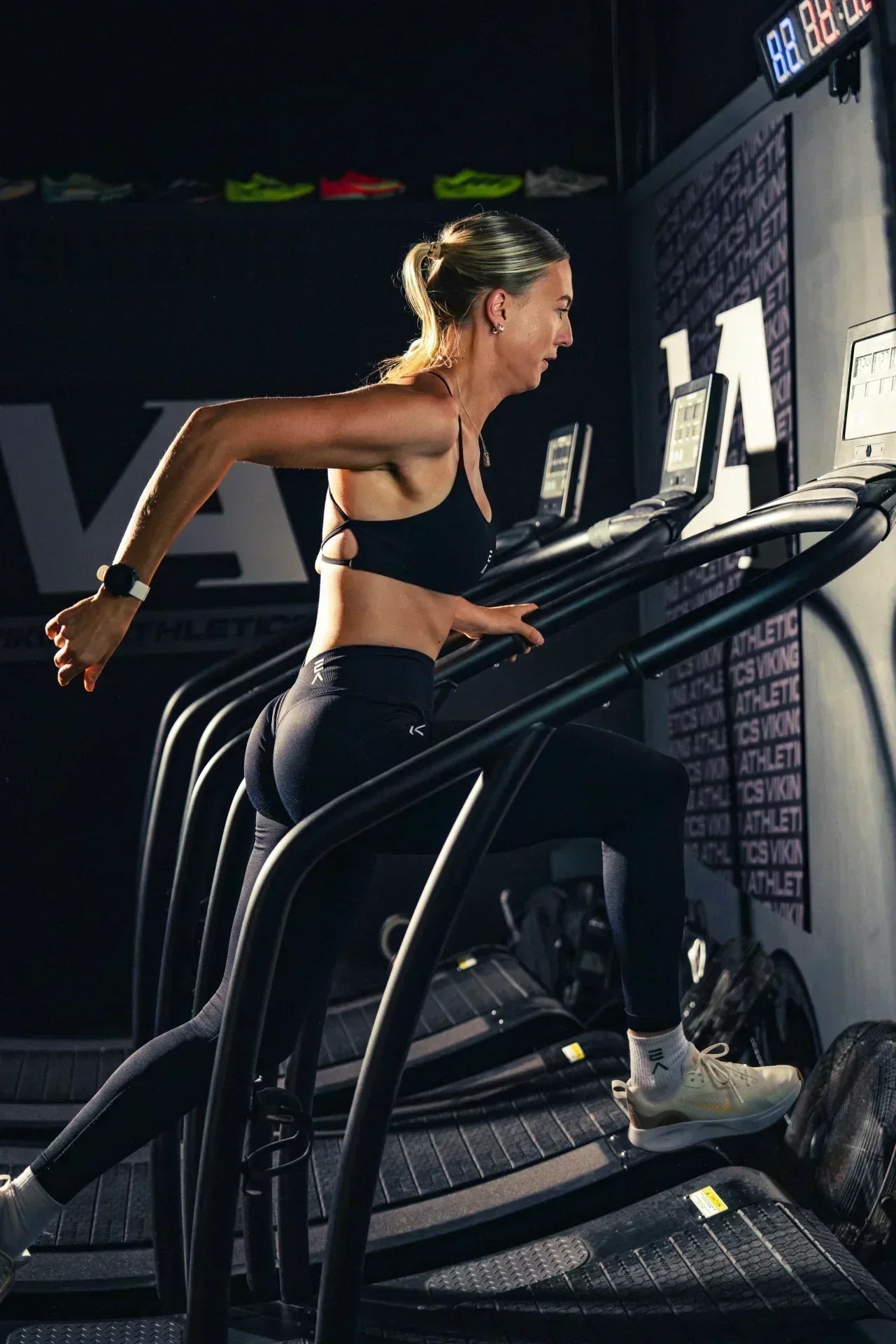 Woman training in the gym wearing black EVO Active leggings