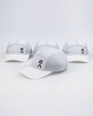 Four Evo Ice white EVOActive Unisex Core Run Caps arranged front-facing, with one cap in front at a slight side angle