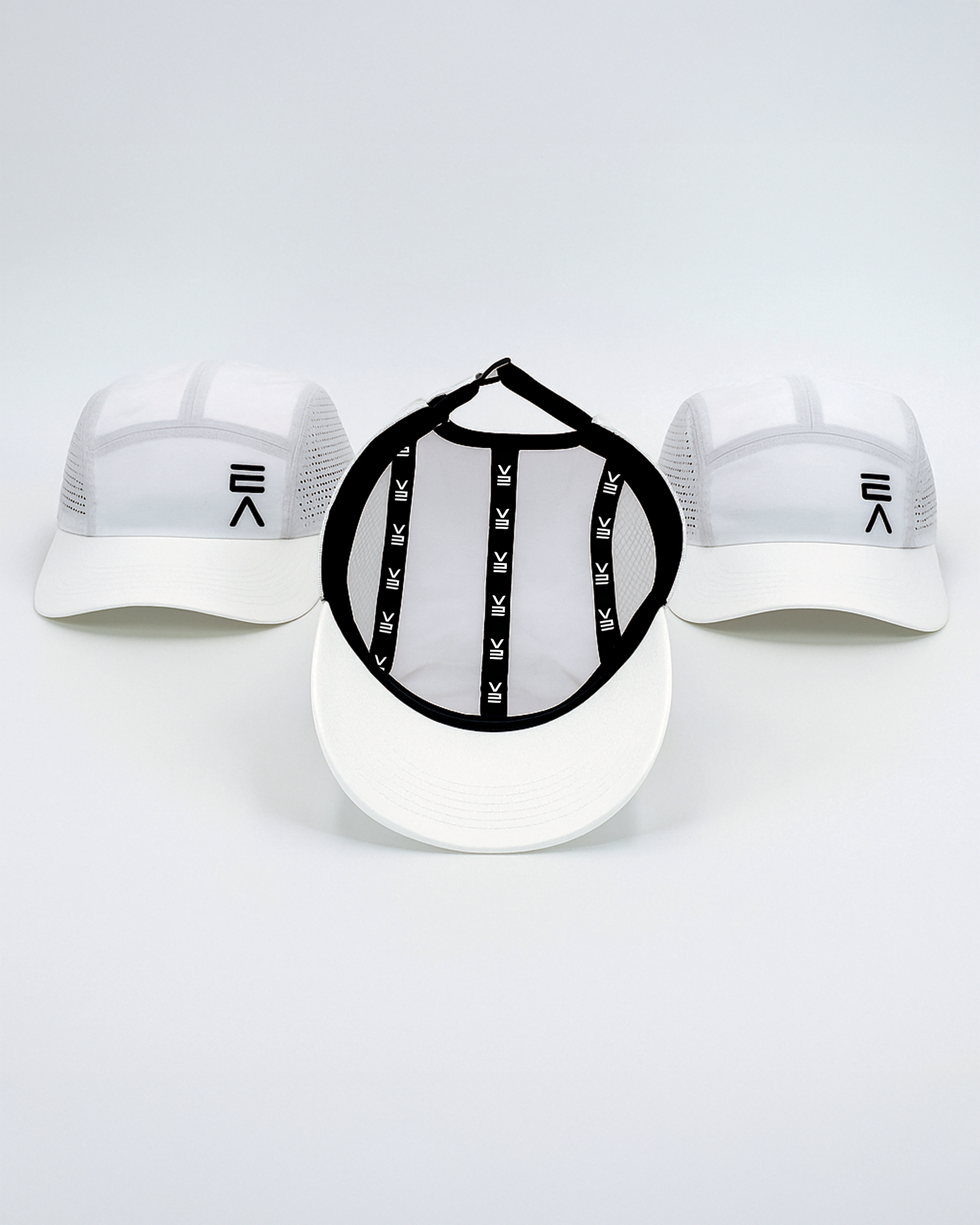 Studio product image of three Evo Ice white EVOActive Unisex Core Run Caps, with one cap shown from the inside displaying the EVOActive logo