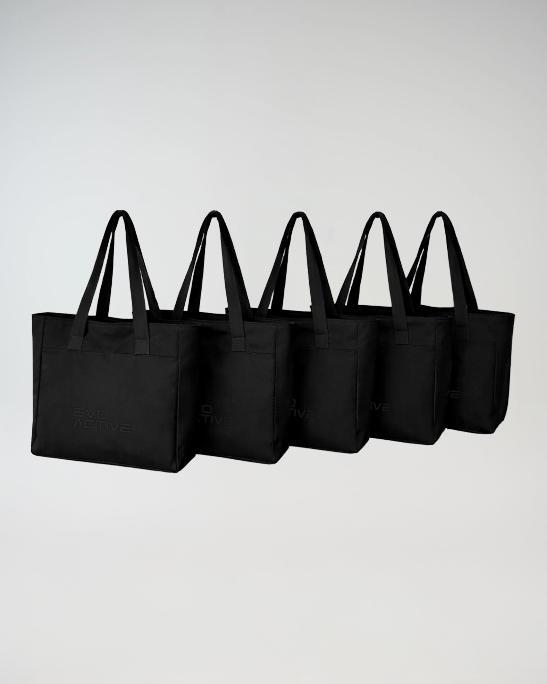Five EVOActive tote bags lined up, highlighting versatile everyday carry options for gym, and daily use