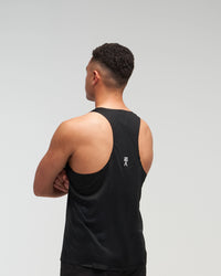 Back view of man wearing midnight black EVOActive Men’s Aero Singlet with logo visible
