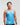 Front view of man wearing ocean blue EVOActive Men’s Aero Singlet with logo visible against a bright background