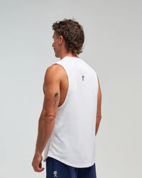 Half-body back view of man wearing Evo Ice white EVOActive Men’s Flex Singlet in a slight side pose with logo visible