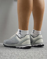 Back and side view of Evo Ice white EVOActive Sprint Low Sock with logo visible against a bright studio background
