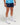 Half-body view of man wearing deep blue EVOActive Unisex Aero Run Short with logo visible on the shorts against a bright background