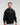 Front view of man in a slight side pose wearing midnight black EVOActive Unisex Classic Pullover Hoody against a bright background